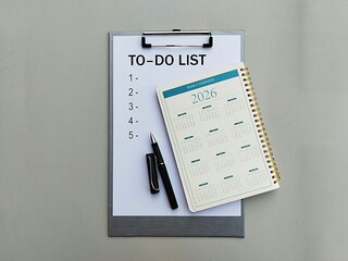 To-Do List printed paper with 2026 monthly calendar notebook and black ball point pen