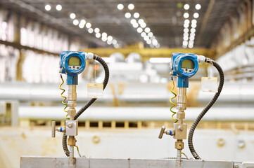 Electronic temperature sensors in a manufacturing facility showing precision instruments for...