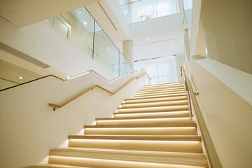 Modern staircase ascending in a bright, airy interior