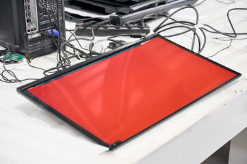 Monitor screen testing process at electronics manufacturing plant during quality assurance procedure