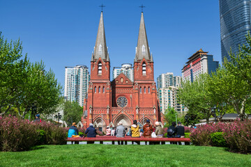 Chinese people at garden view St. Ignatius Xujiahui Cathedral, Shianghai