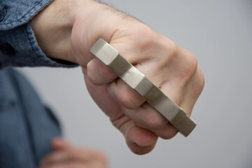 Blow brass knuckles from the bottom up, causing serious bodily harm, a threat to life and health.