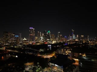 Obraz premium Beautiful Austin skyline at night with a stunning aerial drone view