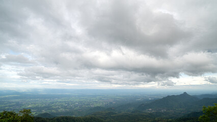 Landscape of a city surrounded by natural mountains. clouds above are dense. Lom Kao city in the morning. At Phu Thap Boek Phetchabun Thailand.