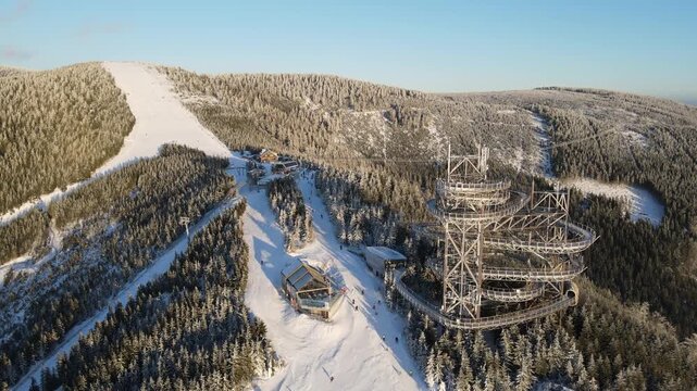 Drone video of the winter ski resort of Doln&iacute; Morava, Czech Republic. Aerial footage of the snowy winter landscape, forests and ski slopes.
