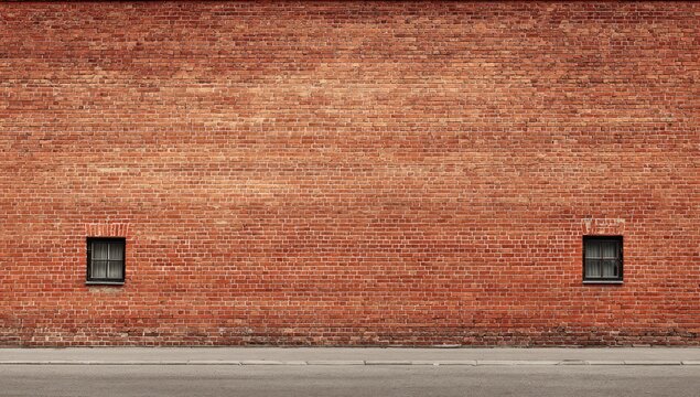 Brick wall with two small windows - Powered by Adobe