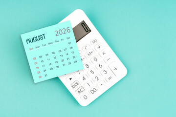 August 2026 calendar card with calculator on blue color background.