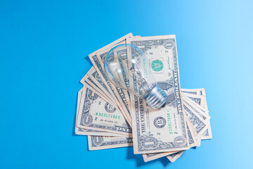 dollars in a blue jar with one piece of one hundred dollar bills