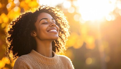 Joyful Young Woman Enjoying Autumn Sunshine in Nature Outdoors