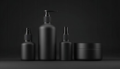 Four matte black cosmetic containers on a dark background