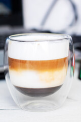 A close up of a cup of coffee on a table