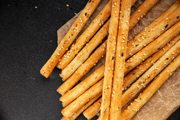 Grissini breadsticks whole grain cereal fresh delicious gourmet food background on the table rustic food top view copy space
