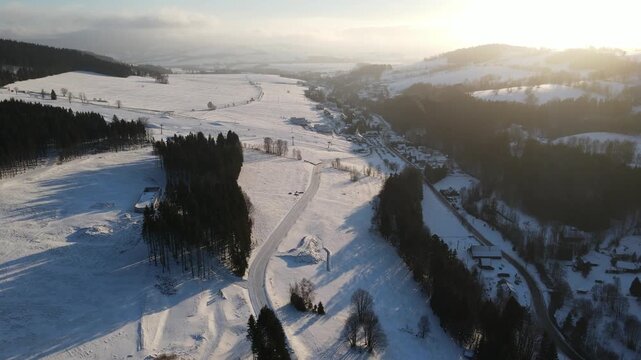 Drone video of the winter ski resort of Doln&iacute; Morava, Czech Republic. Aerial footage of the snowy winter landscape, forests and ski slopes.