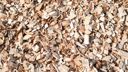 The photo shows a close-up of wood chips