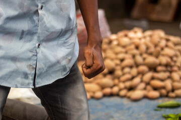 A man shows his hand in various styles in the market