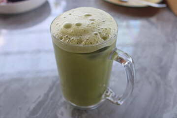 Refreshing Iced Matcha Green Tea with Frothy Foam