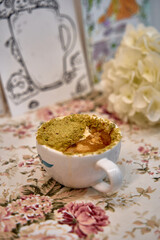 Delicious Dessert in a Cup: A Lusciously Layered Treat with Unique Textures and Flavors Perfect for Any Occasion, Adorned with Elegant Floral Surroundings