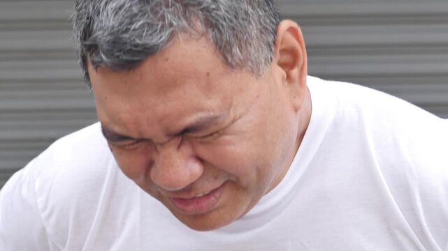 Middle aged old uncle asian man being sick with stomachache concept image for abdominal pain, diarrhea, constipation, food poisoning, gastritis, acid reflux, ulcer, stomach cancer, colon cancer