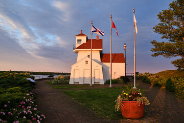 The Fort Point Lighthouse in Liverpool Nova Scotia at sunset makes for striking colors