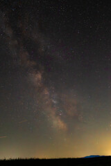 A river of starlight weaves across night’s velvet skin—galaxies glowing, dust...
