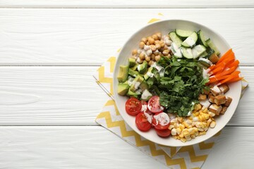 Different healthy vegetarian food on white wooden table, top view. Space for text
