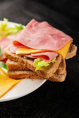 Sandwich ham, cheese, bread toast meat spam fresh delicious gourmet food background on the table rustic food top view copy space