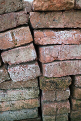 Weathered Red Bricks with Moss and Dirt