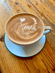 cup of coffee on wooden table
