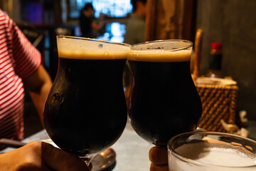 dark beers on the table at the bar