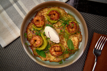 Deliciously Crafted Dish Featuring Grilled Shrimp, Fresh Vegetables, and Creamy Accompaniment on a Beautiful Plate