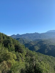 Majestic mountains: green ridges under a bottomless summer sky.