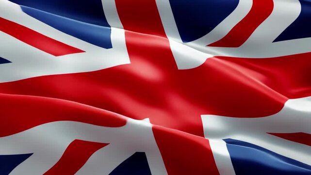 Dynamic close-up of a waving Union Jack flag, captured from a low angle, perfect for a patriotic video backdrop or themed presentation. Live desktop wallpaper.
