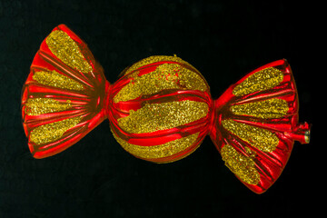Christmas candy ornament isolated on black background