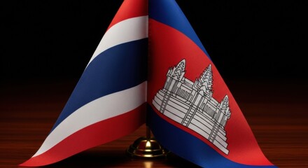 Intertwined national symbols flags of thailand and cambodia signifying diplomatic relations