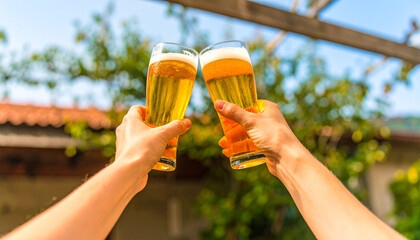 man holding a glass of beer