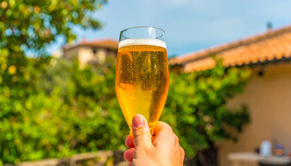 glass of beer in hand