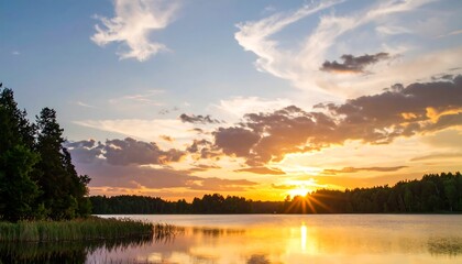 Obraz premium Scenic sunset over a lake