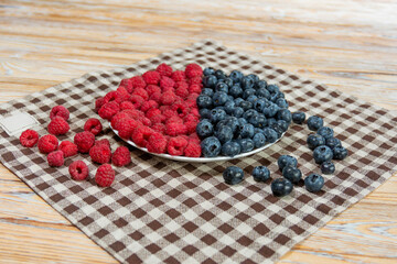 Colorful Mix of Raspberries and Blueberries on Rustic Cloth