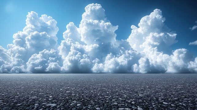 Vast asphalt expanse under a dramatic sky filled with cumulus clouds