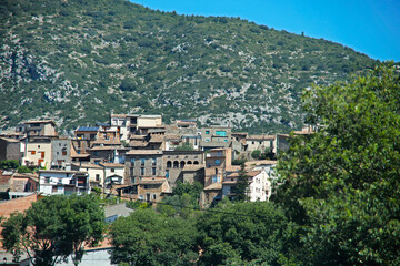 A small village with randomly located houses between picturesque mountains