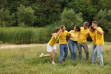 Team building. Group of happy people together outdoors