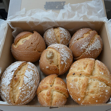 fresh bread and pastries arranged in a breadbox