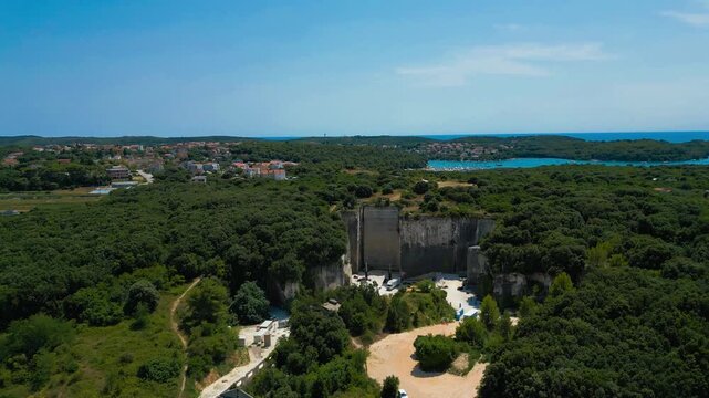 Ancient Roman quarry Cave Romane near Pula, Croatia &ndash; historic stone site surrounded by forest, dramatic rock formations