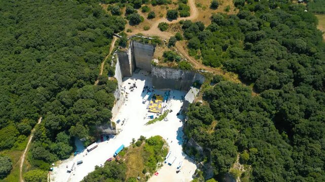 Ancient Roman quarry Cave Romane near Pula, Croatia &ndash; historic stone site surrounded by forest, dramatic rock formations