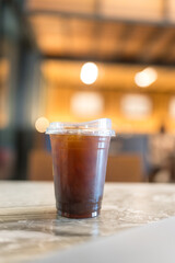 A refreshing iced Americano on table at cafe