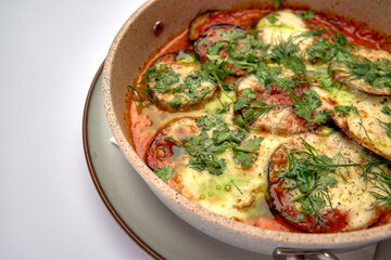 Delicious Baked Dish Featuring Layers of Zucchini, Tomatoes, and Cheese Topped with Fresh Herbs for a Flavorful Culinary Experience