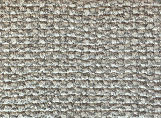 Close up of light grey synthetic fabric resembling rattan or wicker weaving art, or bamboo panel. Seamless background texture.