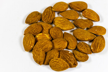 Pile of Brown Almond Seeds on Clean White Background