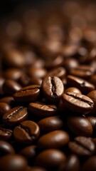 Dark roasted coffee beans piled vividly on a surface showcasing rich texture and color in soft natural lighting