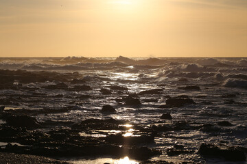 Raging waves of the Atlantic Ocean at sunset
